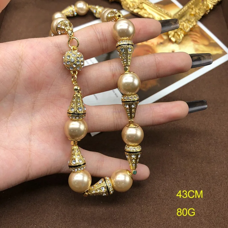 Medieval Western Glazed Pearl Necklace Earrings Set with Diamond Champagne Retro Jewelry Magnetic Buckle Switch
Medieval Western Glazed Pearl Necklace Earrings Set with Diamond Champagne Retro Jewelry Magnetic Buckle Switch
