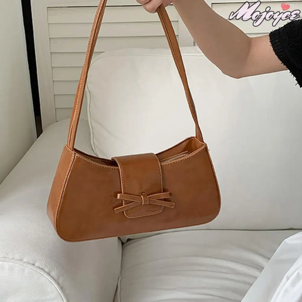 Sweet Bow Y2K Handbag PU Leather Underarm Pouch Women Retro Clutch Purse with Zipper Girls Causal Handbag Chic Top-Handle Bags 
Sweet Bow Y2K Handbag PU Leather Underarm Pouch Women Retro Clutch Purse with Zipper Girls Causal Handbag Chic Top-Handle Bags