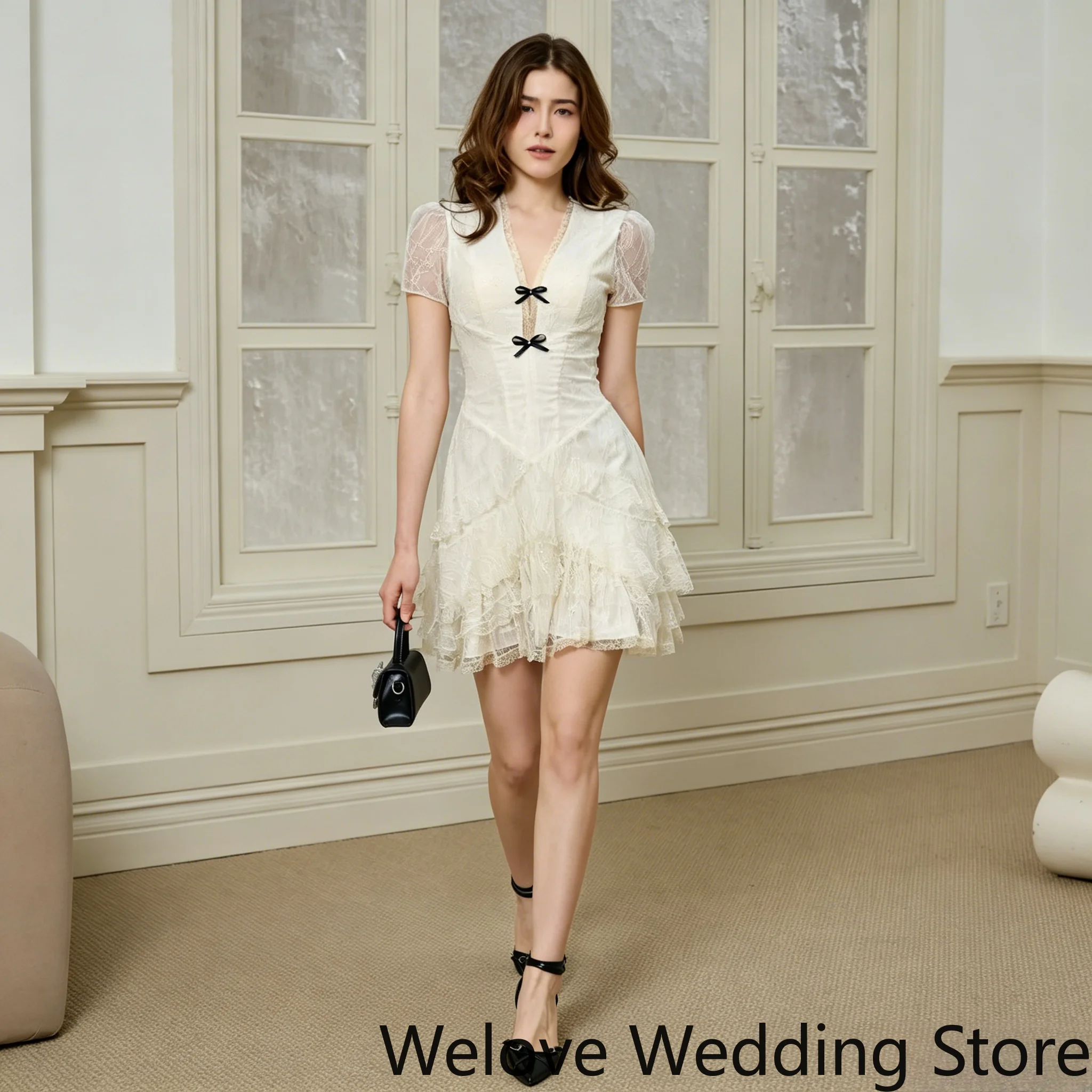 Cream White Sweet Feminine Mini Dress with Deep V‑Neck, Sheer Puff Short Sleeves, Two Black Bow Accents, Textured Lace Fabric
Cream White Sweet Feminine Mini Dress with Deep V‑Neck, Sheer Puff Short Sleeves, Two Black Bow Accents, Textured Lace Fabric