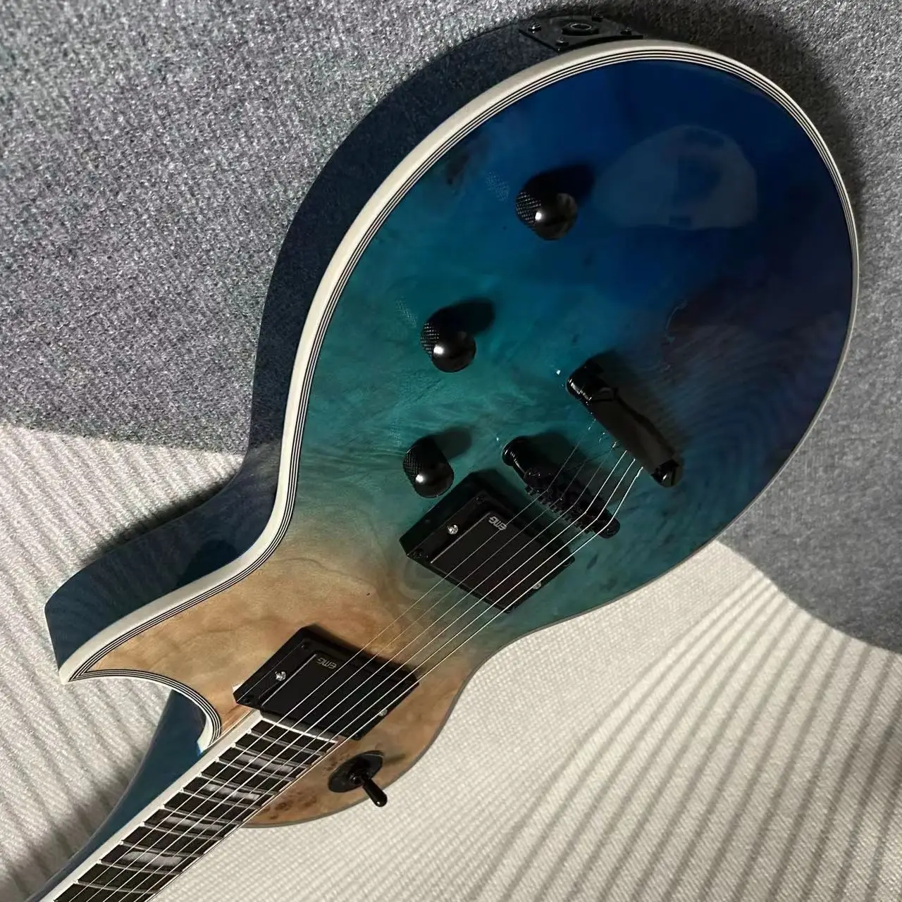 Electric Guitar Mahogany Body Ocean Sunburst Color Black Hardware Burl Maple Top
Electric Guitar Mahogany Body Ocean Sunburst Color Black Hardware Burl Maple Top