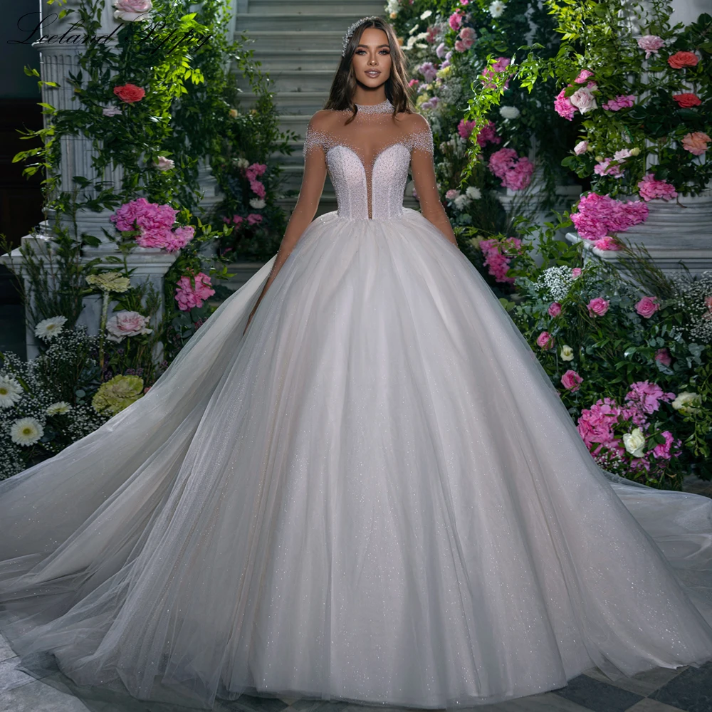 Lceland Poppy Ball Gown Crystal Beaded ShinyTulle Wedding Dresses 2023 Floor Length Long Sleeves Bridal Gowns with Royal Train
Lceland Poppy Ball Gown Crystal Beaded ShinyTulle Wedding Dresses 2023 Floor Length Long Sleeves Bridal Gowns with Royal Train