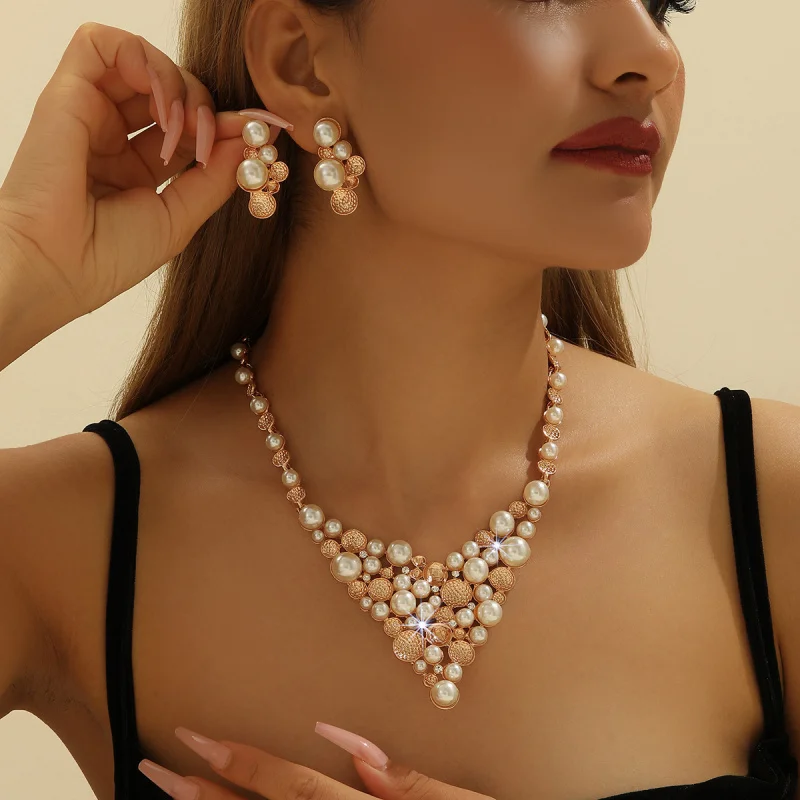 Gold Zinc Alloy Inlaid Faux Pearl Exaggerated Necklace and Earring Set for Women Jewelry Accessories
Gold Zinc Alloy Inlaid Faux Pearl Exaggerated Necklace and Earring Set for Women Jewelry Accessories