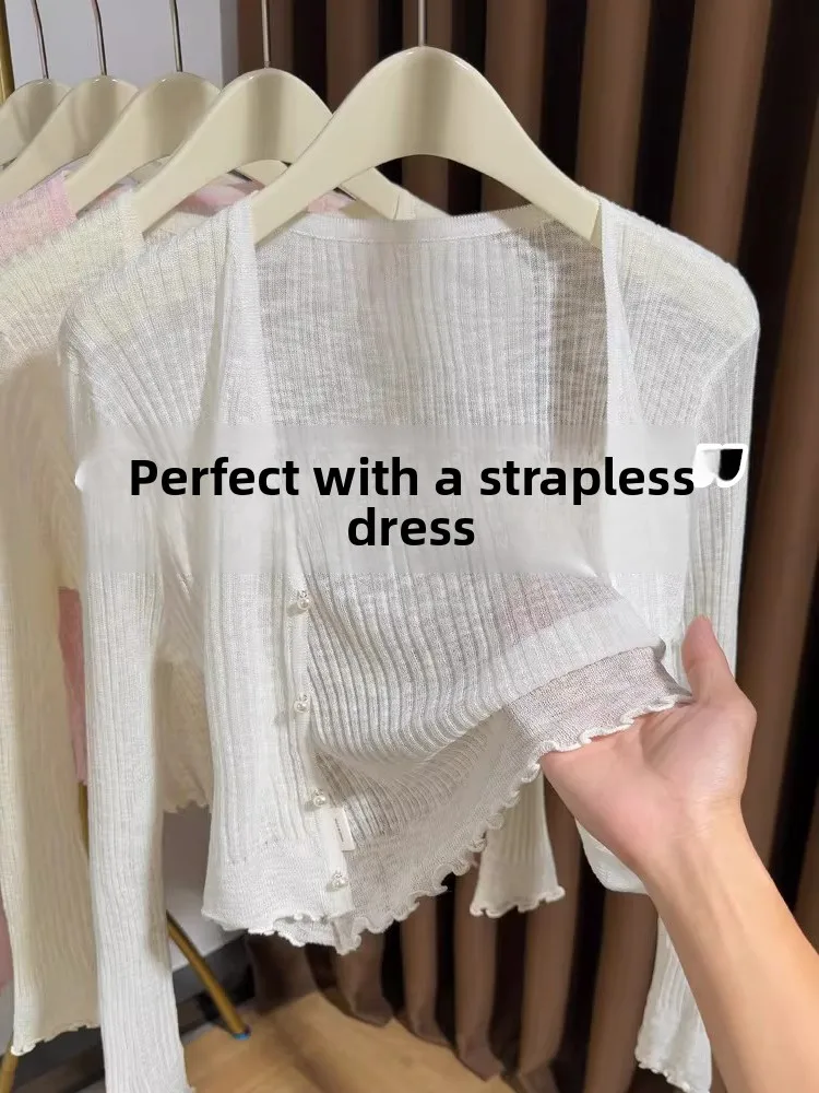 White Ice Silk Knitted Cardigan Women's Summer New Style Strap Outer Cover High-End Sensation Small Shawl Lightweight Jacket
White Ice Silk Knitted Cardigan Women's Summer New Style Strap Outer Cover High-End Sensation Small Shawl Lightweight Jacket