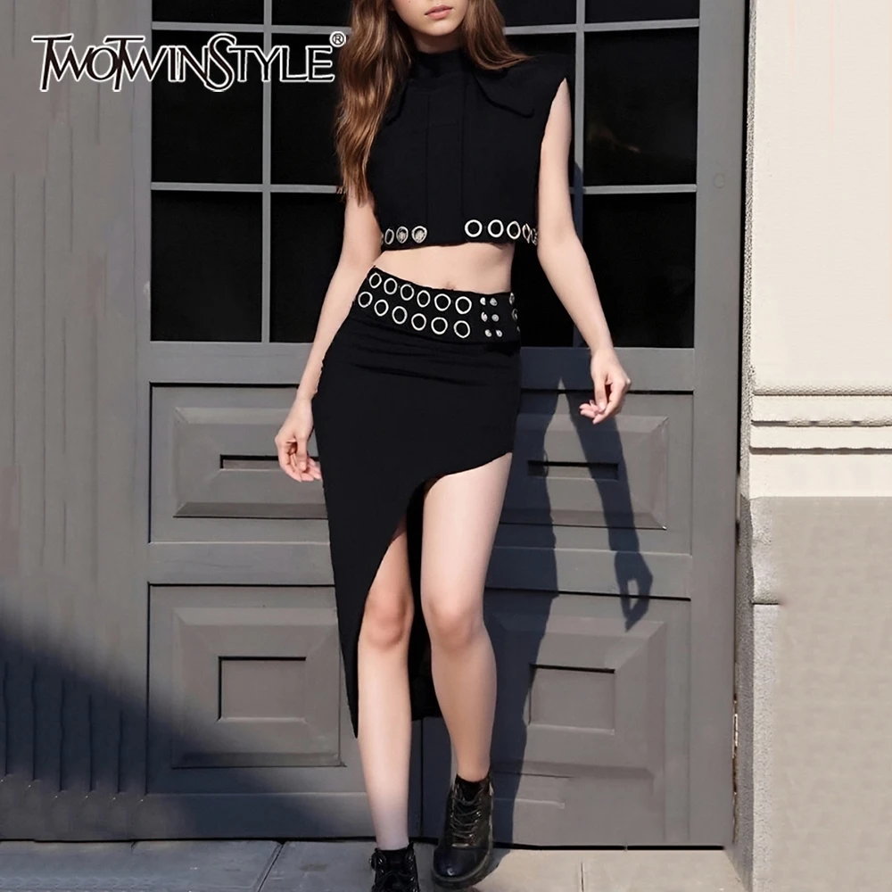 TWOTWINSTYLE Solid Spliced Metal Ring Two Piece Sets for Women Stand Neck Sleeveless Top High Waist Irregular Skirt Set Female
TWOTWINSTYLE Solid Spliced Metal Ring Two Piece Sets for Women Stand Neck Sleeveless Top High Waist Irregular Skirt Set Female