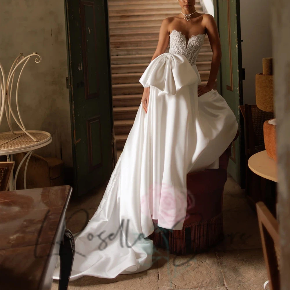 LRosella элегантное свадебное платье без рукавов с кружевной аппликацией и жемчугом в форме сердца, свадебное платье со шлейфом, платья de novia 2025
LRosella элегантное свадебное платье без рукавов с кружевной аппликацией и жемчугом в форме сердца, свадебное платье со шлейфом, платья de novia 2025