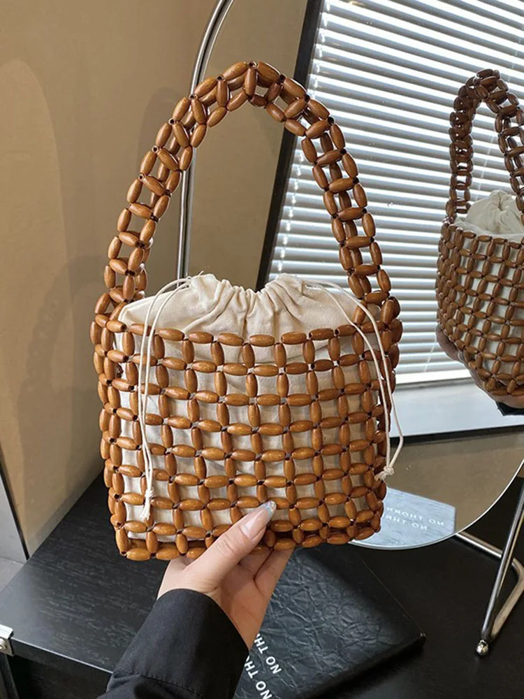 French Retro Hollow Out Women Woven Bags High End Simple Solid Color Beading Bucket Bag 2026 Spring Summer New Vacation Handbags
French Retro Hollow Out Women Woven Bags High End Simple Solid Color Beading Bucket Bag 2026 Spring Summer New Vacation Handbags