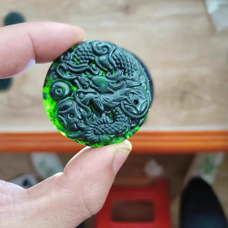 A natural dark green jade money dragon pendant is a festival gift for family members, symbolizing a continuous flow of wealth
A natural dark green jade money dragon pendant is a festival gift for family members, symbolizing a continuous flow of wealth