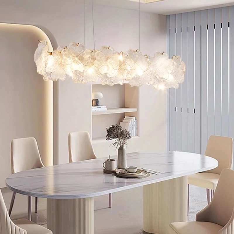 French-style minimalist restaurant - modern and simple long dining table with crystal chandelier
French-style minimalist restaurant - modern and simple long dining table with crystal chandelier