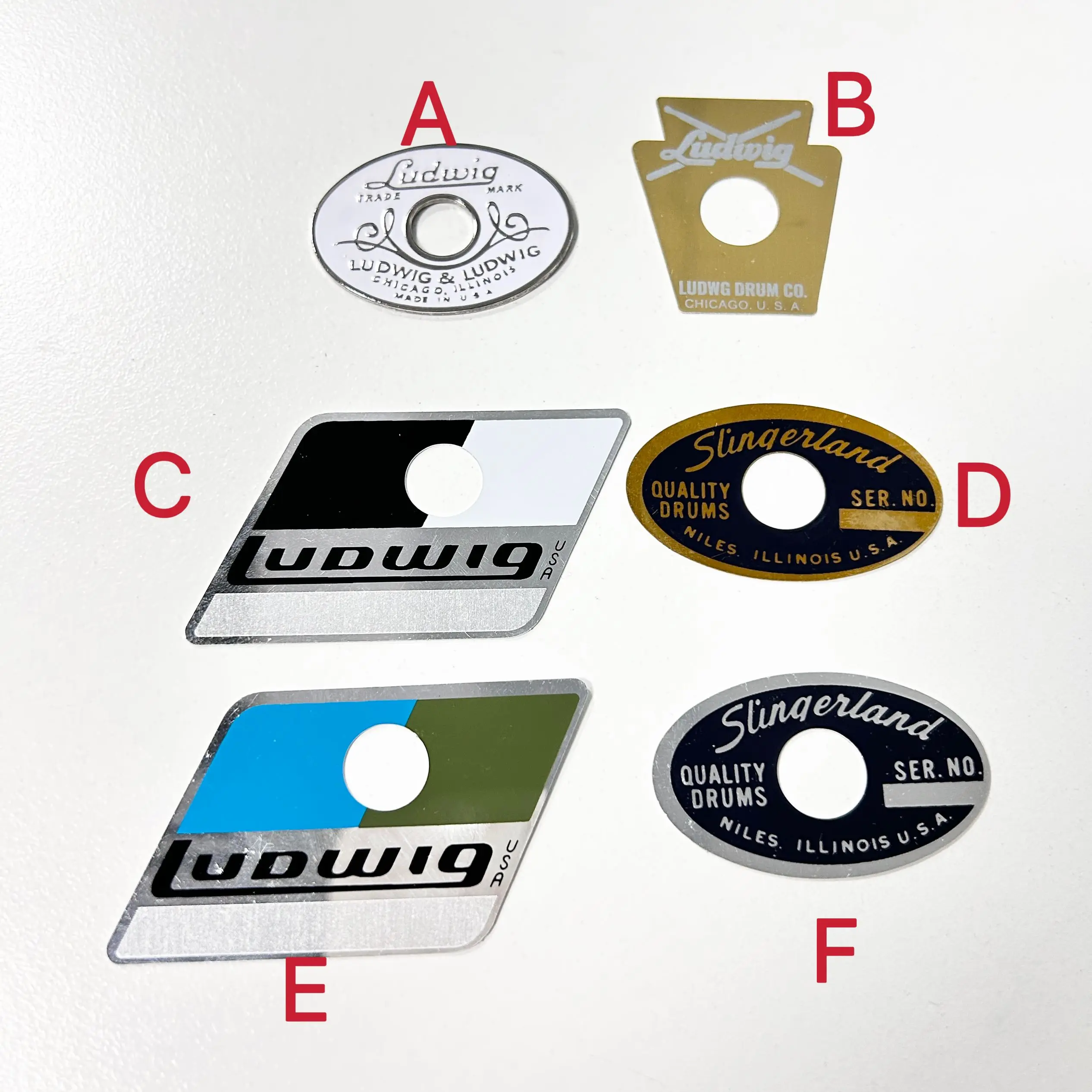 Vintage Drum Badges: Ludwig Keystone/White & Silver/Blue & Olive, Slingerland Niles Black & Brass (1962-70)/Black & Silver
Vintage Drum Badges: Ludwig Keystone/White & Silver/Blue & Olive, Slingerland Niles Black & Brass (1962-70)/Black & Silver