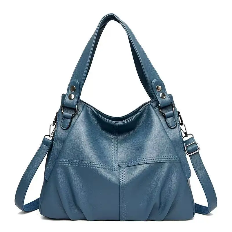 Soft leather single-shoulder bag with studded decoration, wide top handle, detachable and adjustable crossbody strap, patchwork design, large-capacity shoulder bag.
Soft leather single-shoulder bag with studded decoration, wide top handle, detachable and adjustable crossbody strap, patchwork design, large-capacity shoulder bag.