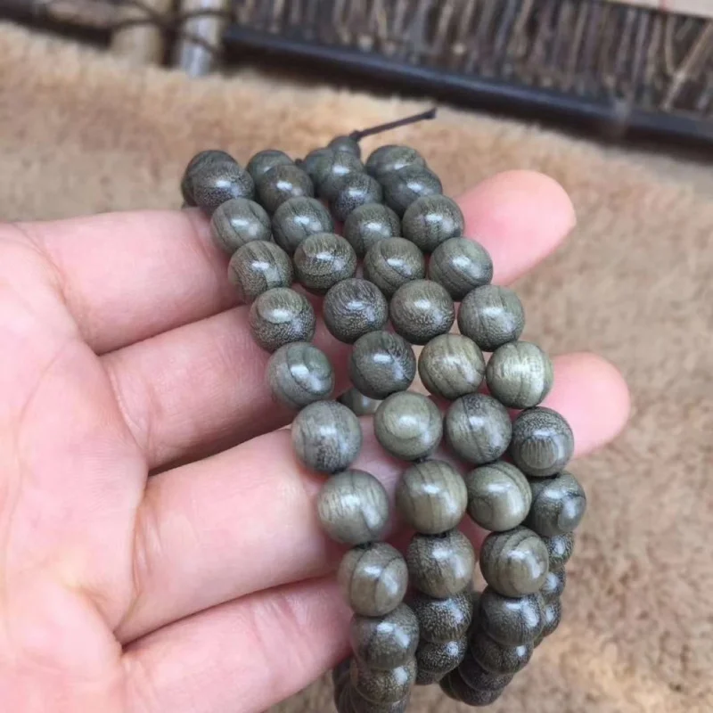 Golden nanmu wood bracelet, 108 , wooden cultural and artistic item, Buddhist prayer beads, with secret script
Golden nanmu wood bracelet, 108 , wooden cultural and artistic item, Buddhist prayer beads, with secret script
