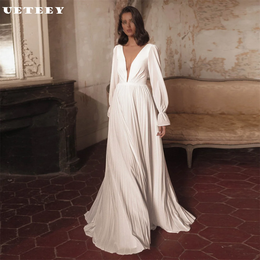 UETEEY Customized Simple Deep V Neck Long Puff Sleeve Crepe A Line Wedding Dress Elegant Pleat Open Court Train Bridal Gown
UETEEY Customized Simple Deep V Neck Long Puff Sleeve Crepe A Line Wedding Dress Elegant Pleat Open Court Train Bridal Gown