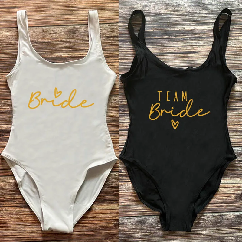 Team Bride Swimwear Women Bathing Suit Sexy Gold Bride One-Piece Swimsuit Woman 2025 Summer Beach wear maillot de bain femme
Team Bride Swimwear Women Bathing Suit Sexy Gold Bride One-Piece Swimsuit Woman 2025 Summer Beach wear maillot de bain femme