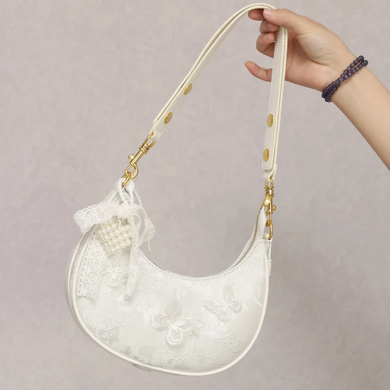 Сумки в форме полумесяца для женщин, роскошные дизайнерские сумки и кошельки, новинка 2025, модная вышивка, кружевной бант, расшитая бисером через плечо
Сумки в форме полумесяца для женщин, роскошные дизайнерские сумки и кошельки, новинка 2025, модная вышивка, кружевной бант, расшитая бисером через плечо
