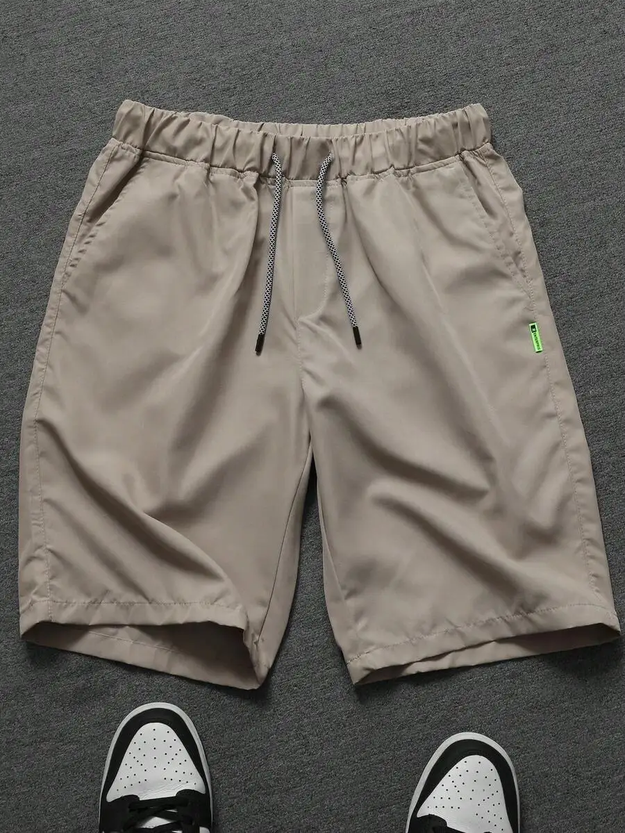 Men Beige Solid Casual Shorts With Elastic Waistband, Drawstring Closure, Side Pockets And Green Label
Men Beige Solid Casual Shorts With Elastic Waistband, Drawstring Closure, Side Pockets And Green Label