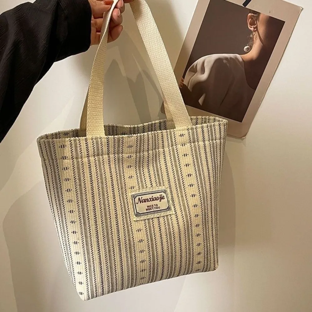 New Versatile Canvas Bag Large Capacity Durable Striped Tote Bag Lightweight Handheld Bag Commuting
New Versatile Canvas Bag Large Capacity Durable Striped Tote Bag Lightweight Handheld Bag Commuting