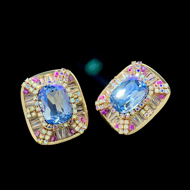 Sparkling Gold Tone Stud Earrings with Large Blue Stone and Multicolor CZ Halo luxury jewelry
Sparkling Gold Tone Stud Earrings with Large Blue Stone and Multicolor CZ Halo luxury jewelry