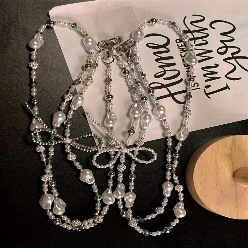 Creative New Phone Lanyard Pearl Bow Heart Beaded Crossbody Bag Charm Accessory, Mobile Case Chain Pendant for Women & Girls
Creative New Phone Lanyard Pearl Bow Heart Beaded Crossbody Bag Charm Accessory, Mobile Case Chain Pendant for Women & Girls