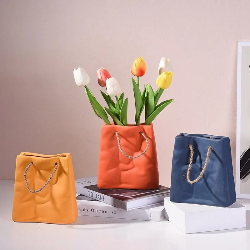 Modern Minimalist Ceramic Flower Vase Bag Shaped Dry Flower Flower Arrangement Home Decorations Tabletop Decorations
Modern Minimalist Ceramic Flower Vase Bag Shaped Dry Flower Flower Arrangement Home Decorations Tabletop Decorations