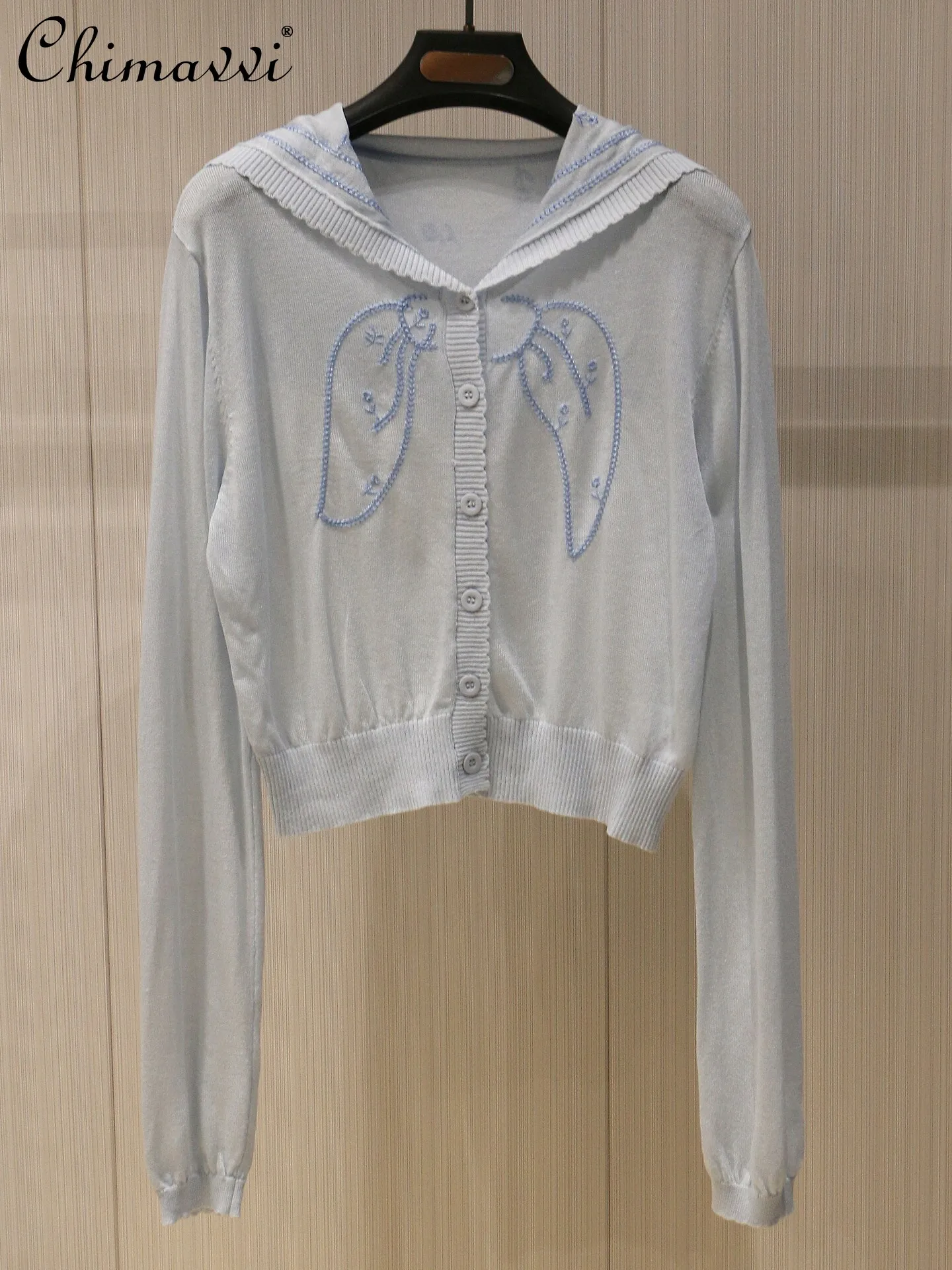 2026 Spring and Summer Sweet Light Blue Bow Embroidered Sheer Cardigan Women's Fashion Navy Collar Slim-fit Knit Top
2026 Spring and Summer Sweet Light Blue Bow Embroidered Sheer Cardigan Women's Fashion Navy Collar Slim-fit Knit Top