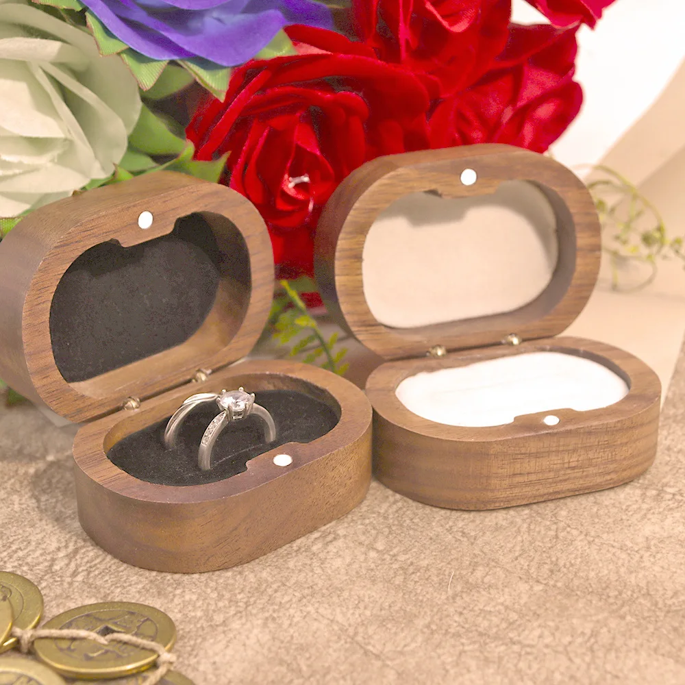 Oval Black Walnut Proposal Pair Ring Jewelry Carving Storage Packaging Gift Box Female.High-grade solid wood gift box.
Oval Black Walnut Proposal Pair Ring Jewelry Carving Storage Packaging Gift Box Female.High-grade solid wood gift box.