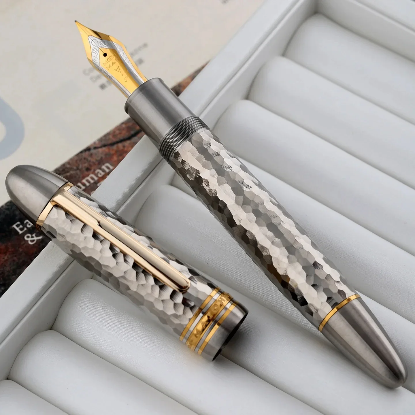 New MAJOHN P141 Large Piston Filling Fountain Pen With No.8 Size Nib Made Of Solid Titanium With Unique Hammered Design Gift
New MAJOHN P141 Large Piston Filling Fountain Pen With No.8 Size Nib Made Of Solid Titanium With Unique Hammered Design Gift