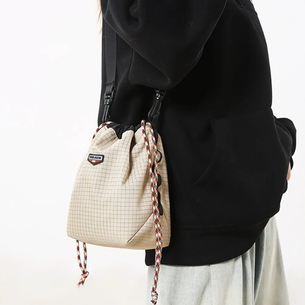 Nylon Drawstring Bucket Bag Lightweight Adjustable Strap Sports Crossbody Bag Large Capacity Coin Purse Canvas Shoulder Bag
Nylon Drawstring Bucket Bag Lightweight Adjustable Strap Sports Crossbody Bag Large Capacity Coin Purse Canvas Shoulder Bag