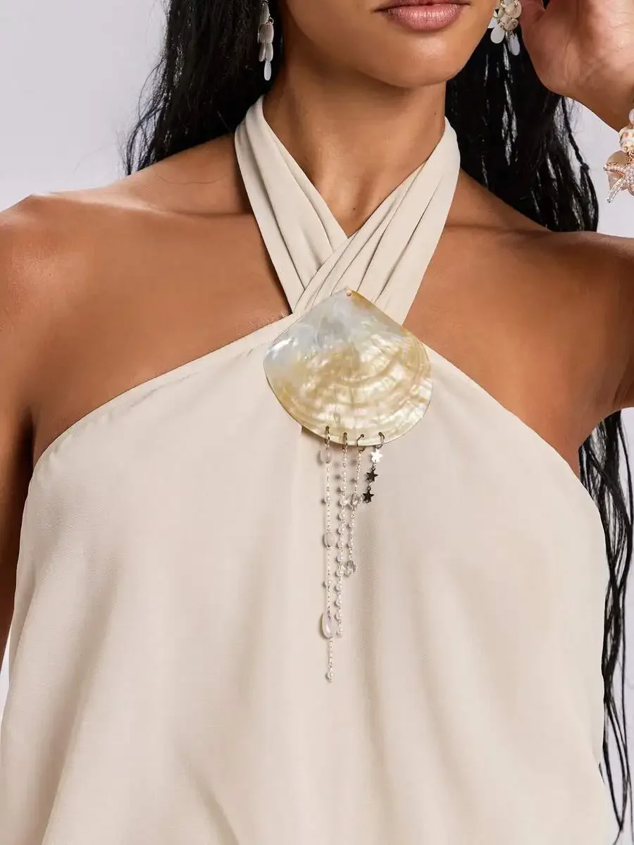 Avant-Garde Shell Decor Halter Backless Mini Dress For Beach Vacation
Avant-Garde Shell Decor Halter Backless Mini Dress For Beach Vacation