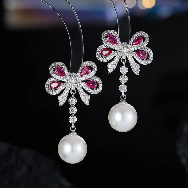 New Exquisite Elegant Bowknot Pearl Tassel Earrings S925 Silver Needle Micro Inlaid Zircon High-end Feel Ear Jewelry Wholesale
New Exquisite Elegant Bowknot Pearl Tassel Earrings S925 Silver Needle Micro Inlaid Zircon High-end Feel Ear Jewelry Wholesale