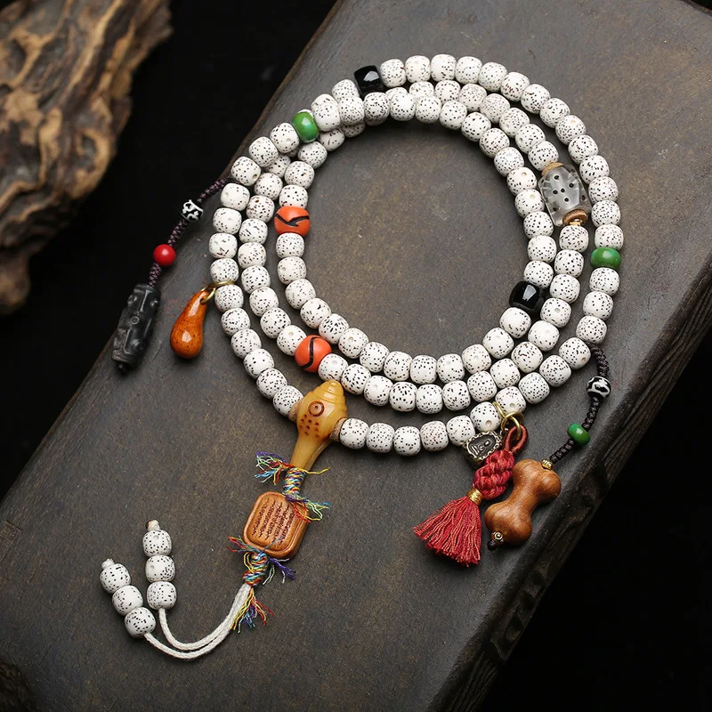 108-bead Tibetan-style prayer beads made from natural star-and-moon bodhi seeds,featuring black agate and recycled bone
108-bead Tibetan-style prayer beads made from natural star-and-moon bodhi seeds,featuring black agate and recycled bone