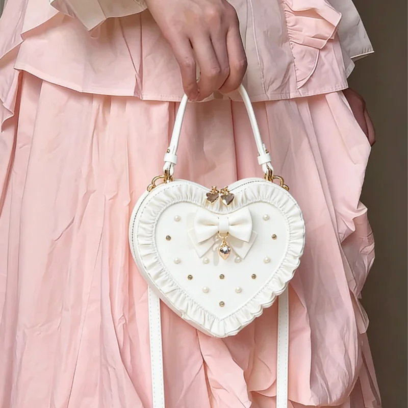 Новая сумка-кроссбоди в форме сердца, в стиле Y2K Lolita, для девочек, с милой кружевной отделкой, бантом и жемчугом, элегантная сумка-клатч.
Новая сумка-кроссбоди в форме сердца, в стиле Y2K Lolita, для девочек, с милой кружевной отделкой, бантом и жемчугом, элегантная сумка-клатч.