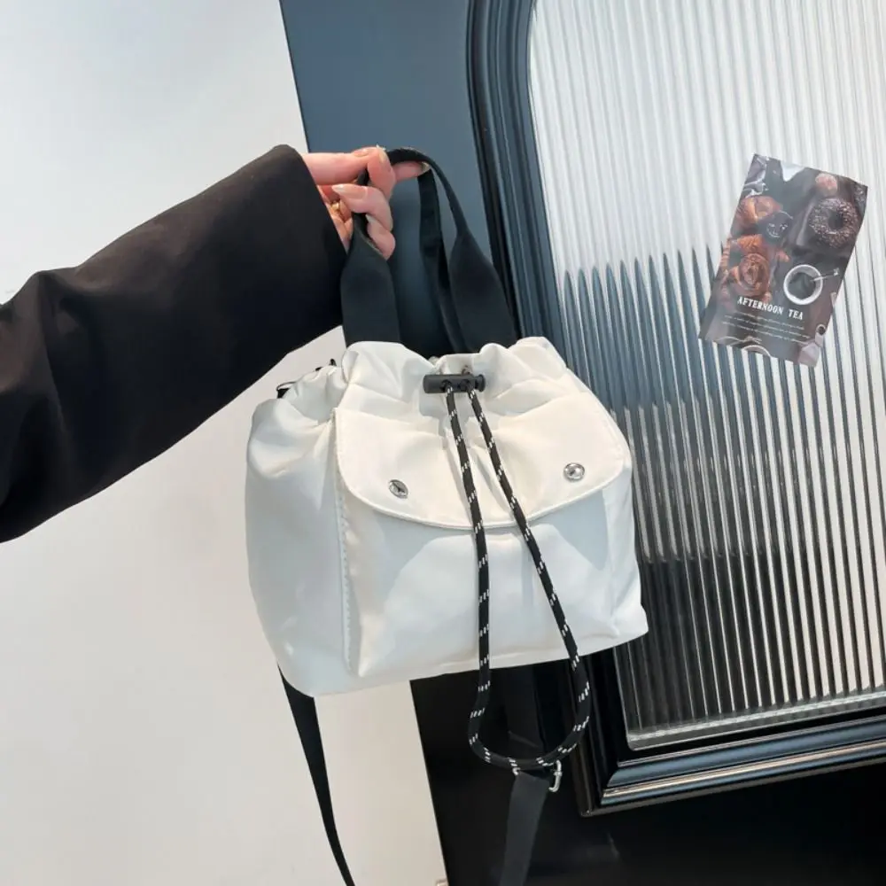 Cute Korean Style Drawstring Bucket Bag Handbag Purse Nylon Shoulder Bag Solid Color Mobile Phone Bag Small Crossbody Bag Women
Cute Korean Style Drawstring Bucket Bag Handbag Purse Nylon Shoulder Bag Solid Color Mobile Phone Bag Small Crossbody Bag Women