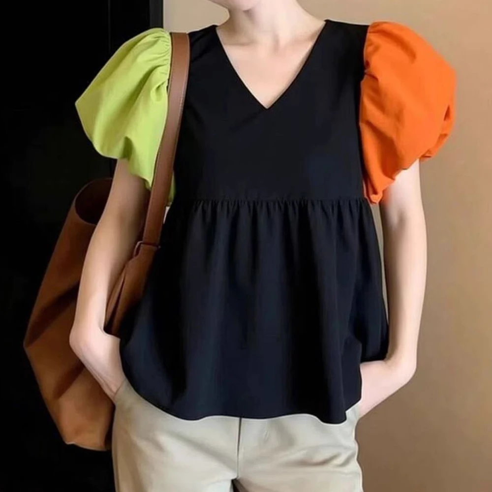 Contrast color bubble sleeve top fashionable, foreign, niche, high-end sense, super good-looking, black shirt woman
Contrast color bubble sleeve top fashionable, foreign, niche, high-end sense, super good-looking, black shirt woman