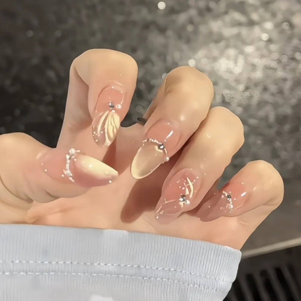 10 шт., золотистый кошачий глаз, накладные ногти ручной работы, овальные ногти средней длины, готовые к дизайне со стразами, набор накладных ногтей
10 шт., золотистый кошачий глаз, накладные ногти ручной работы, овальные ногти средней длины, готовые к дизайне со стразами, набор накладных ногтей