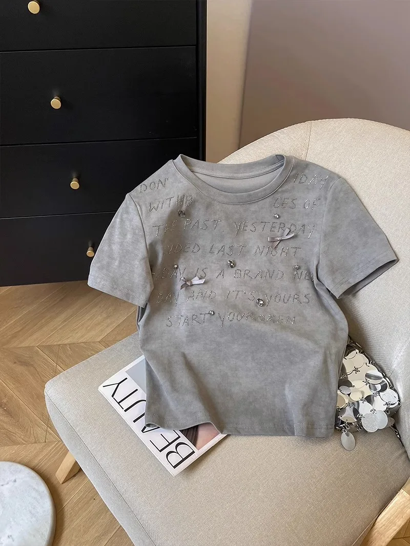 Heavy iron drill letter short sleeve T-shirt women 2024 summer new slimming age slimming round neck shirt
Heavy iron drill letter short sleeve T-shirt women 2024 summer new slimming age slimming round neck shirt