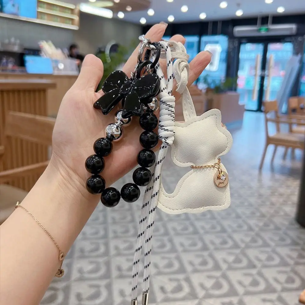 Simple Pearl Bead String Cartoon Cat Pendant Bowknot Cute Key Ring Creative PU Leather Braid Rope Keychain Couple
Simple Pearl Bead String Cartoon Cat Pendant Bowknot Cute Key Ring Creative PU Leather Braid Rope Keychain Couple