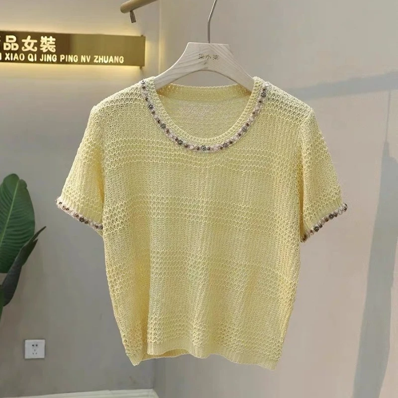 French Retro Style Beading Hollow Out Short Sleeved Sweater Women Knitted T-shirt 2025 Summer O-Neck Pullover Knitwear Tops Tees
French Retro Style Beading Hollow Out Short Sleeved Sweater Women Knitted T-shirt 2025 Summer O-Neck Pullover Knitwear Tops Tees