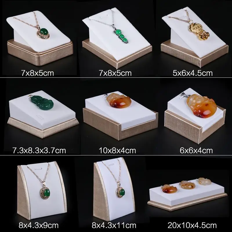 Ожерелье, подвеска, подвеска, сиденье, вешалка для ювелирных изделий, ожерелье, реквизит для демонстрации ювелирных изделий, роскошная белая стойка для демонстрации ювелирных изделий из матовой искусственной кожи
Ожерелье, подвеска, подвеска, сиденье, вешалка для ювелирных изделий, ожерелье, реквизит для демонстрации ювелирных изделий, роскошная белая стойка для демонстрации ювелирных изделий из матовой искусственной кожи