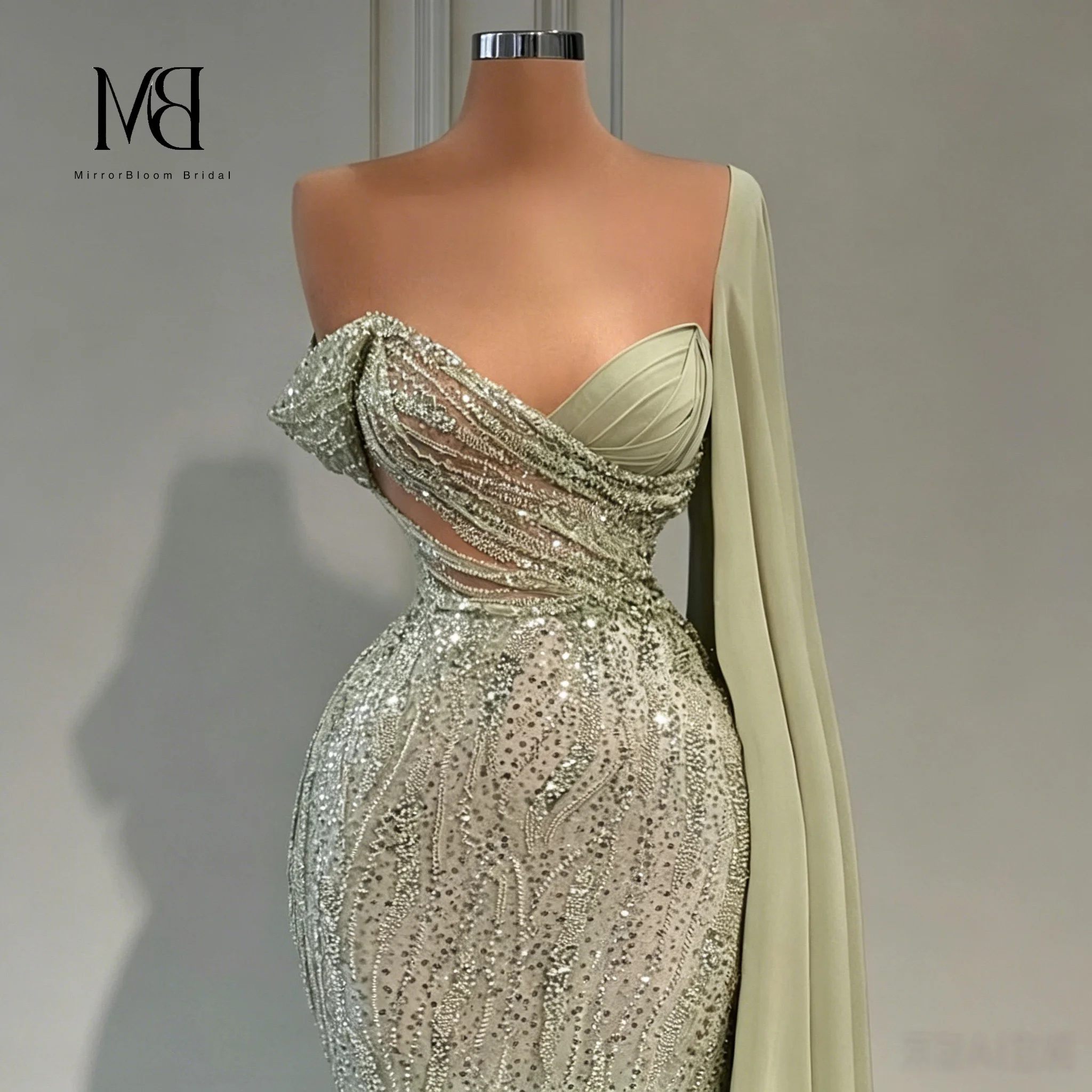 Sophisticated light green strapless evening gown with ribbon cinched waist and heavy-duty sparkling rhinestone design.
Sophisticated light green strapless evening gown with ribbon cinched waist and heavy-duty sparkling rhinestone design.