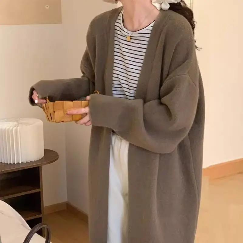 Осенне-зимний свитер в ленивом стиле, женский кардиган, весенне-осеннее новое толстое свободное вязаное пальто выше колена средней длины
Осенне-зимний свитер в ленивом стиле, женский кардиган, весенне-осеннее новое толстое свободное вязаное пальто выше колена средней длины