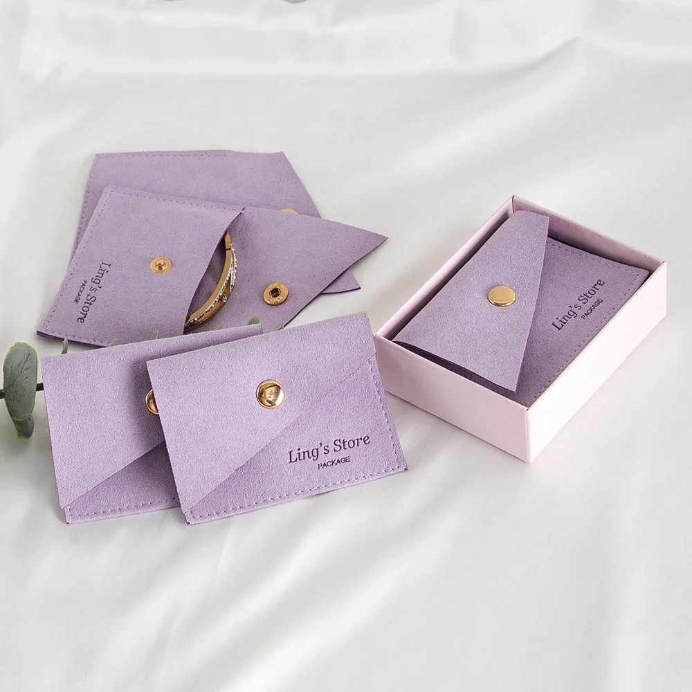 100Pcs Debossed Logo Microfiber Bevel Snap Bag Jewelry Boutique Cosmetic Blush Brush Crystal Pearl Makeup Ring Earring Organizer
100Pcs Debossed Logo Microfiber Bevel Snap Bag Jewelry Boutique Cosmetic Blush Brush Crystal Pearl Makeup Ring Earring Organizer