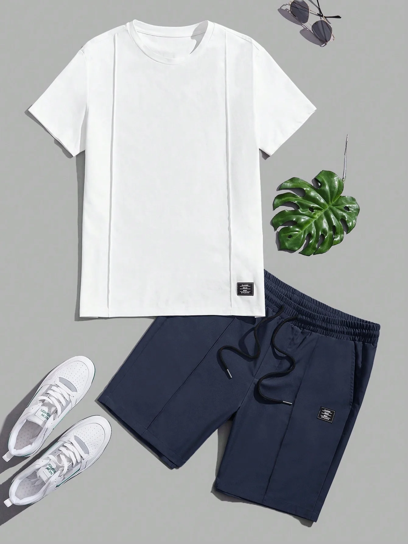 Simple solid-color short-sleeved shorts for summer fashion trend. New style round-neck top for casual men's clothing set.
Simple solid-color short-sleeved shorts for summer fashion trend. New style round-neck top for casual men's clothing set.