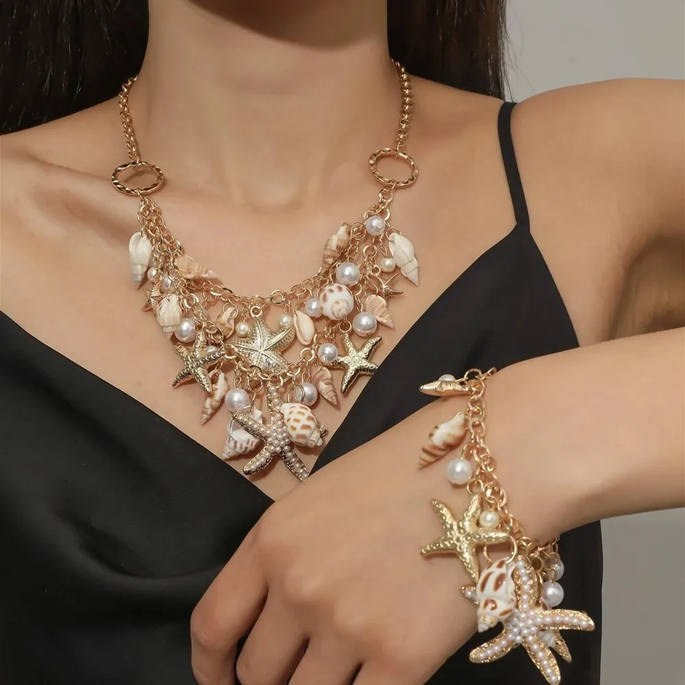 Sweet and versatile conch starfish pendant necklace bracelet set fashion jewelry wholesale
Sweet and versatile conch starfish pendant necklace bracelet set fashion jewelry wholesale