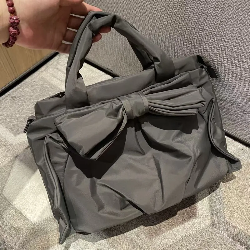 2026 Spring Korean Nylon Bow Crossbody Bag Large Capacity Simple Women Commute Hand Carry Purse
2026 Spring Korean Nylon Bow Crossbody Bag Large Capacity Simple Women Commute Hand Carry Purse