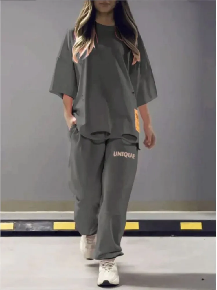 New Autumn Women's Loose Round Neck T-shirt Tops And Pants Set Two-piece Set Fashionable And Casual Solid Color Ripped Top Set
New Autumn Women's Loose Round Neck T-shirt Tops And Pants Set Two-piece Set Fashionable And Casual Solid Color Ripped Top Set