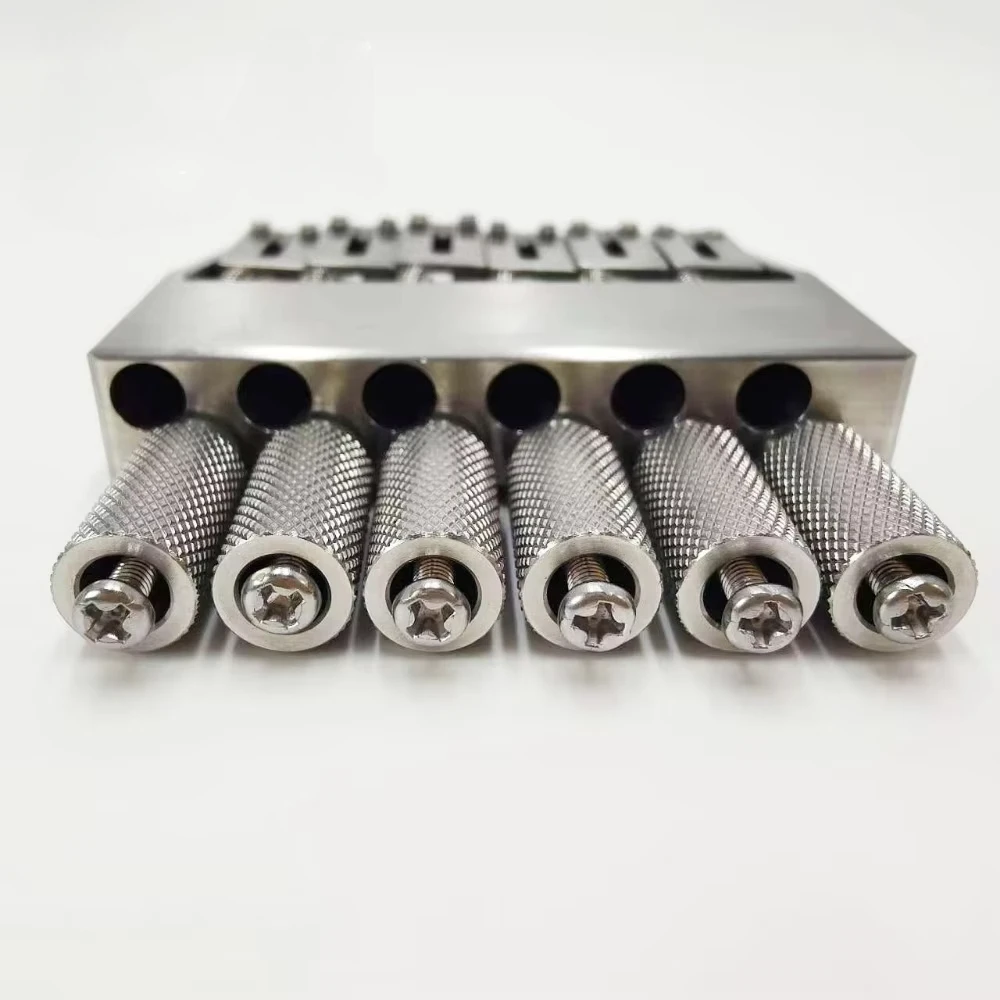 1 pcs 6-String Brass Headless Guitar Bridge for Electric Guitar - High Quality Single Bridge Replacement, Adjustable & Stable 
1 pcs 6-String Brass Headless Guitar Bridge for Electric Guitar - High Quality Single Bridge Replacement, Adjustable & Stable