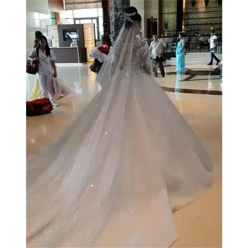 Customized Beadings Appliques Ball Wedding Dresses Sexy Sheer Long Sleeves Beads Ruched Long Train Bridal Gowns
Customized Beadings Appliques Ball Wedding Dresses Sexy Sheer Long Sleeves Beads Ruched Long Train Bridal Gowns