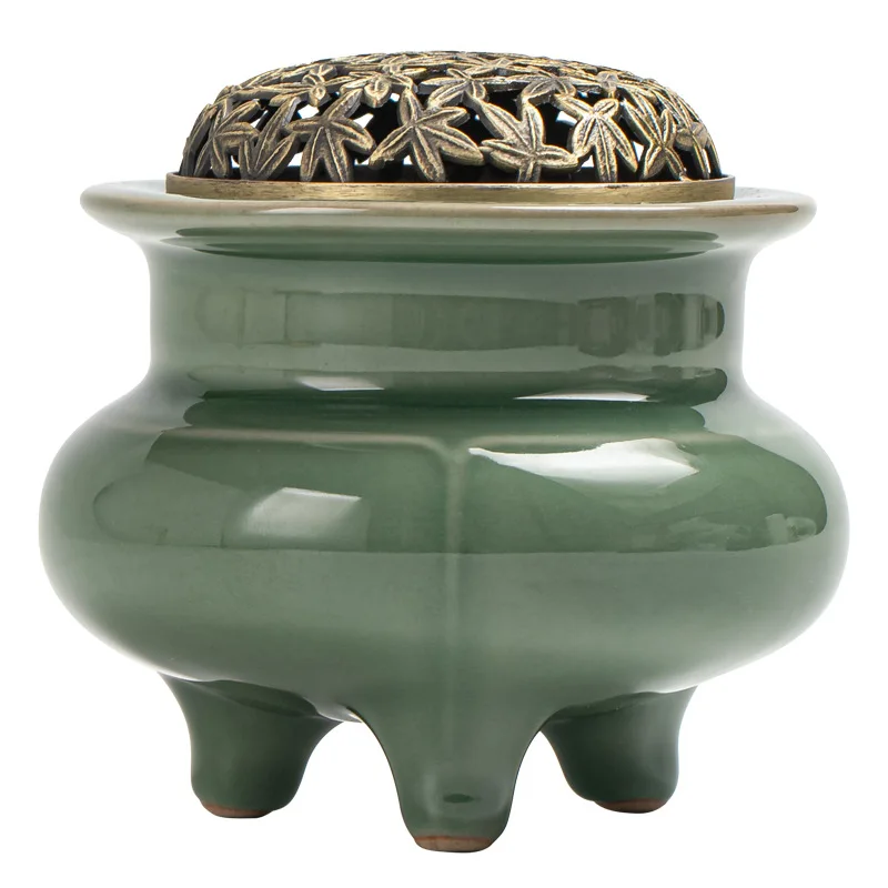 Three-legged high-foot Yue kiln celadon electronic incense burner
Three-legged high-foot Yue kiln celadon electronic incense burner