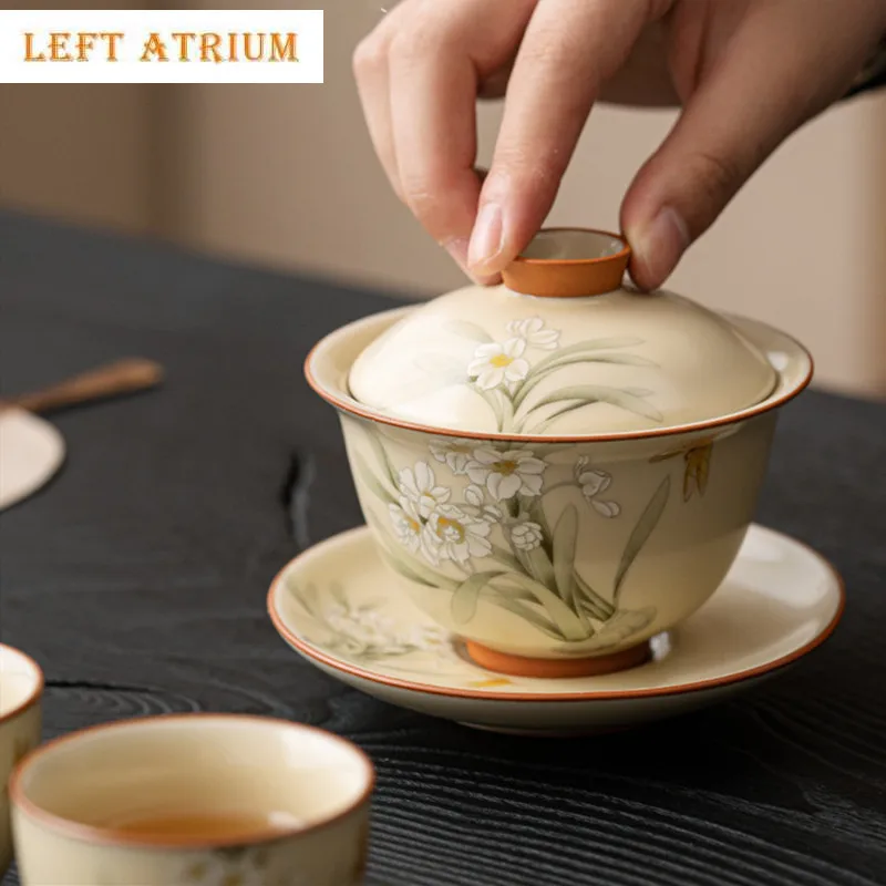Chinese Beige Ru Kiln Tea Tureen Teacup Hand-painted Daffodil Flowers Ceramic Gaiwan Household Tea Bowl Travel Teaware Tea Maker
Chinese Beige Ru Kiln Tea Tureen Teacup Hand-painted Daffodil Flowers Ceramic Gaiwan Household Tea Bowl Travel Teaware Tea Maker