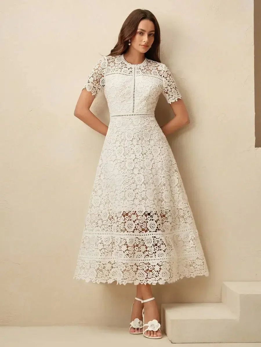 White Floral Lace Midi Dress With Short Sleeves, Round Neck, And Layered Hem Detail
White Floral Lace Midi Dress With Short Sleeves, Round Neck, And Layered Hem Detail